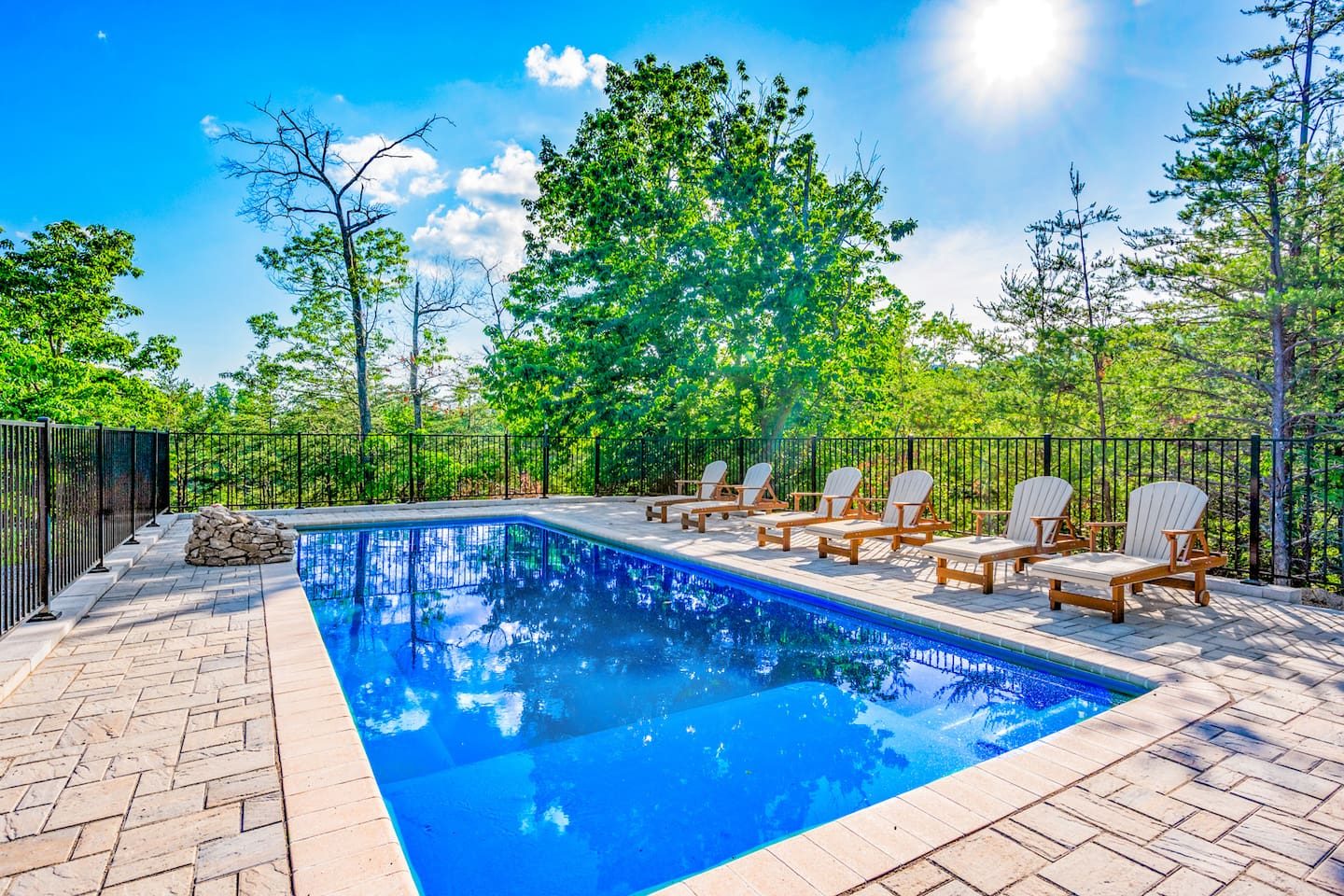Your private pool, with lounge chairs lined up and sunshine on the water. Cannonballs, floaties and long, lazy afternoons await.