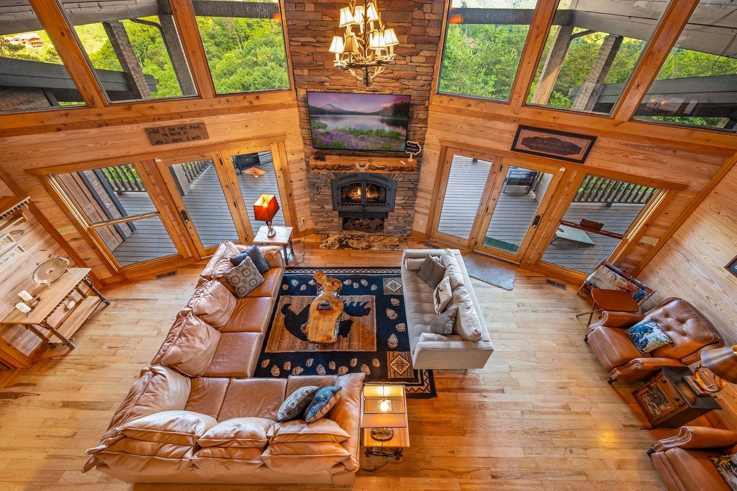Sink into the leather sofas and let the stone fireplace work its magic. Mountain light pours through a wall of windows, and the whole family fits in one big, happy circle.