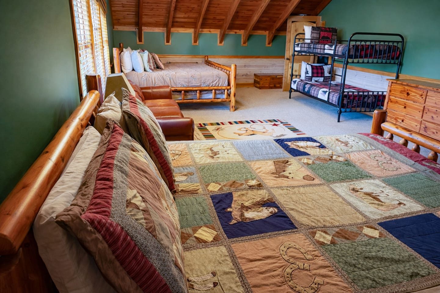 Bunks, log beds and a patchwork quilt that begs for a nap. Giggles, whispered secrets and sleepy goodnights happen here.