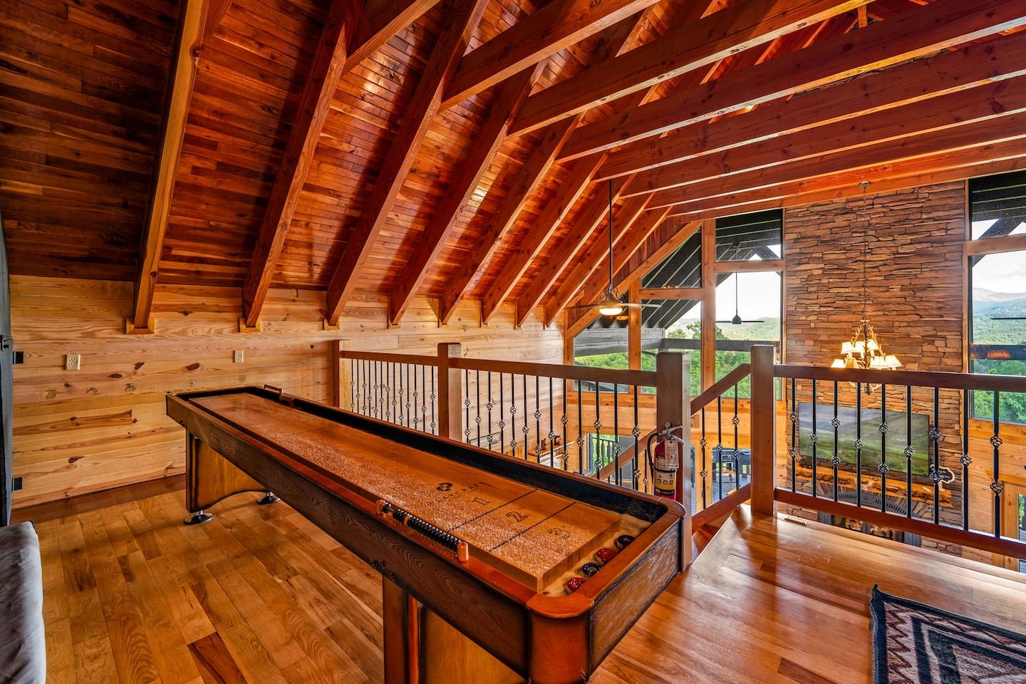 A long shuffleboard table beneath gleaming wood beams. Slide, score and trash-talk your way through a family tournament.