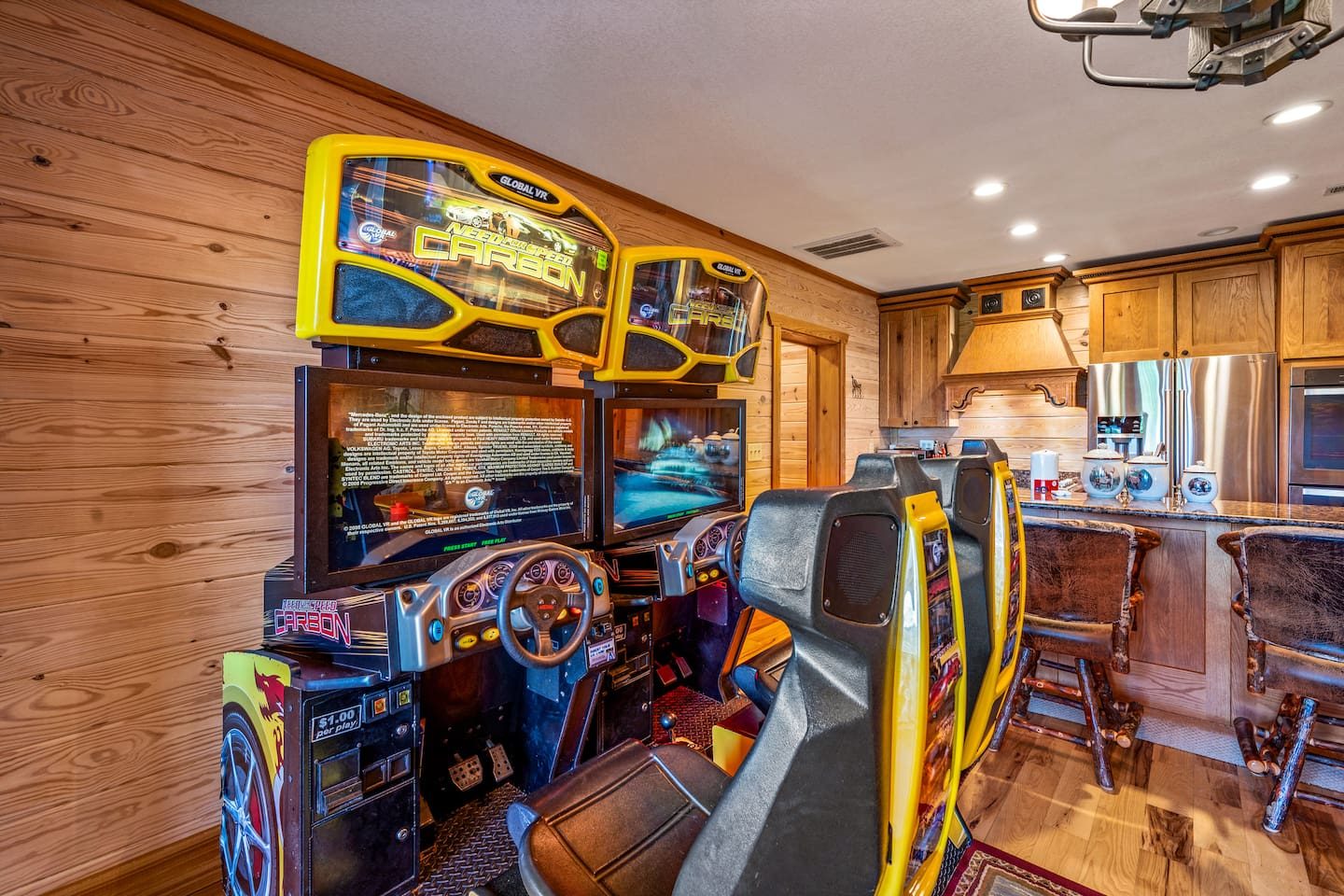 Racing cabinets lined up shoulder to shoulder with seats ready to go. Start your engines and see who takes the checkered flag.