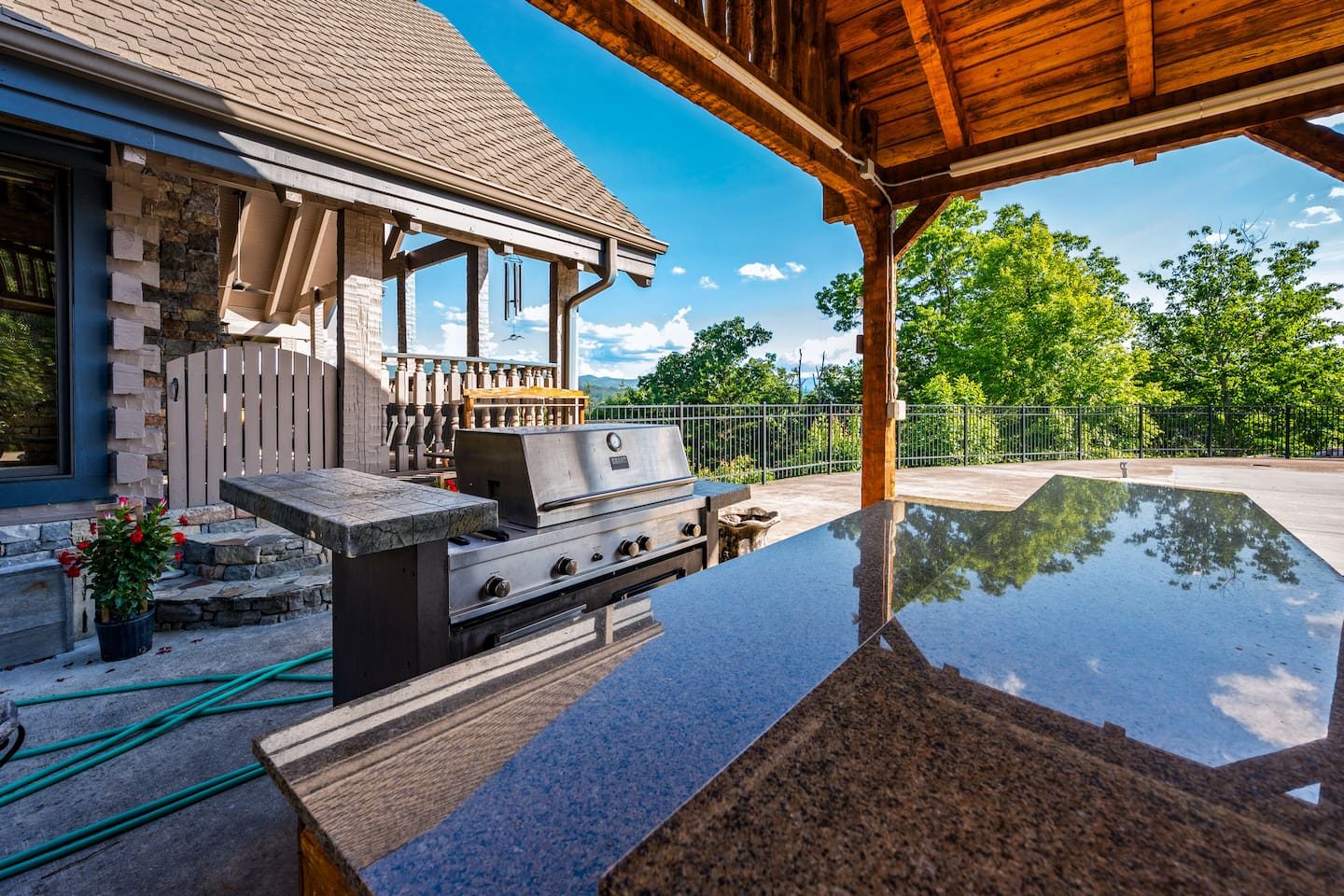 A grill station and gleaming granite counter under the pavilion. Grill, chat and sip as the sun goes down.
