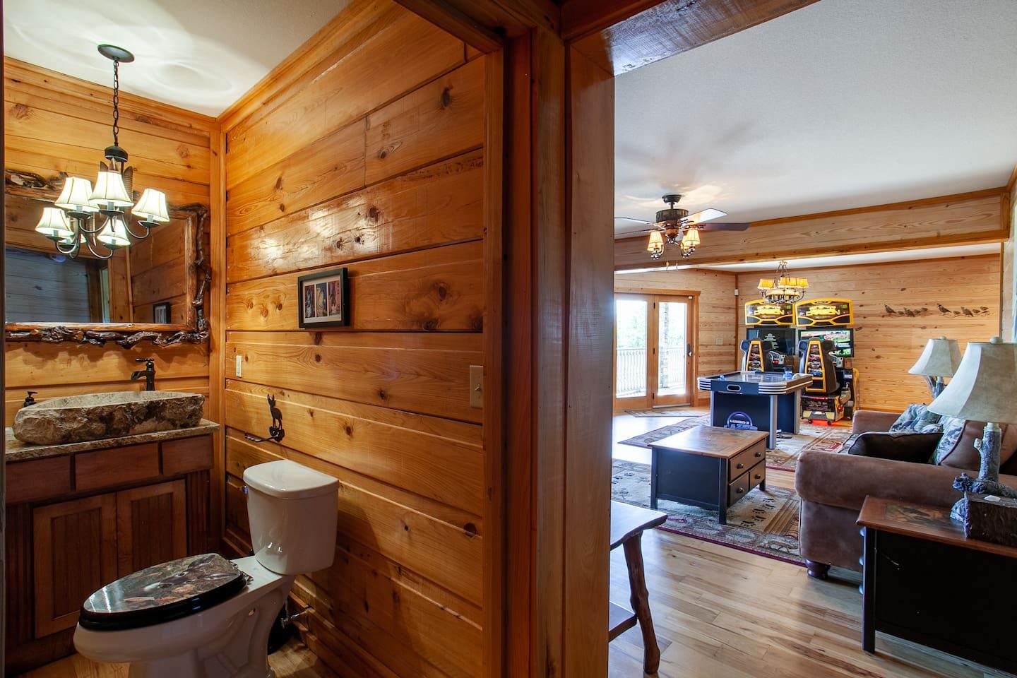 Just off the arcade room, a charming powder room with a stone vessel sink. No one has to leave the fun for long.
